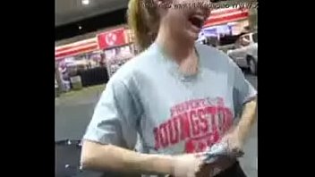 Girl. On gas station shows off