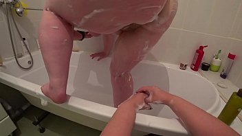 Lesbian fucks mature milf in the bathroom, a bottle in a hairy pussy and appetizing big ass shakes, juicy butt trembles, POV.