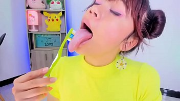 Lila Jordan uses a toothbrush to brush her teeth and tongue
