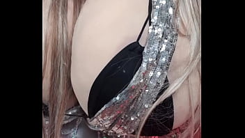 Take a look at sexy Susi. She is lying on the back she is wearing a silver scarf around her big cup k tits and a black bikini.