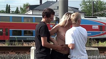 MILF hard PUBLIC threesome fuck at a train station by 2 guys