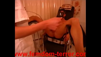 Slave Maskejoe is tort ured by the nurse at the gyne chair with el ectric shocks